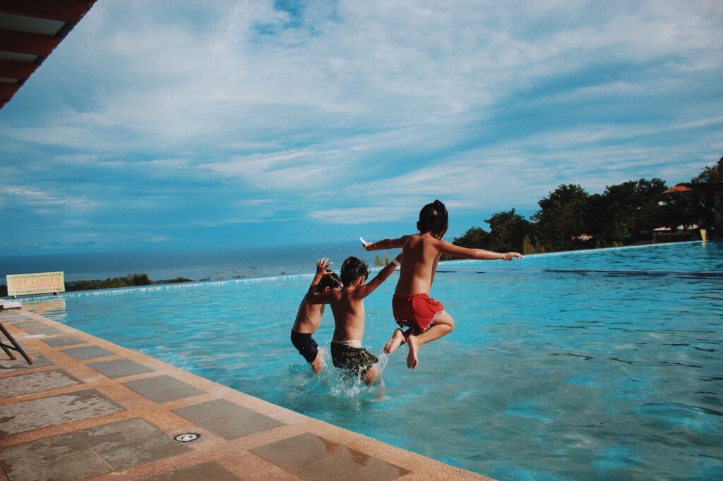 kids jumping in clean pool